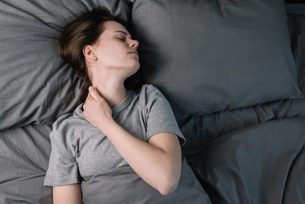 Tired,upset,woman,with,closed,eyes,massage,tense,neck,muscles